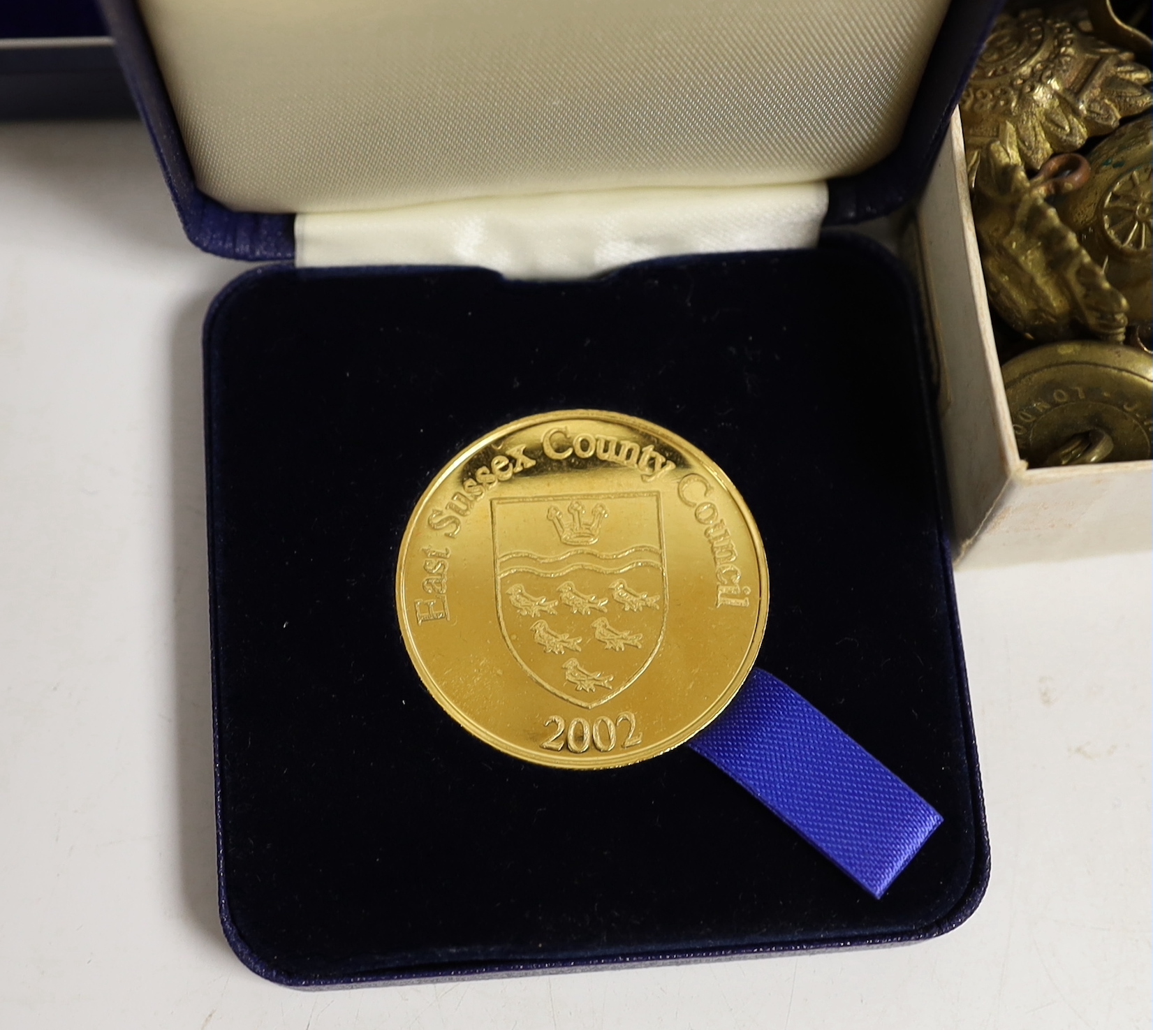 A quantity of medallions, badges etc including some military interest